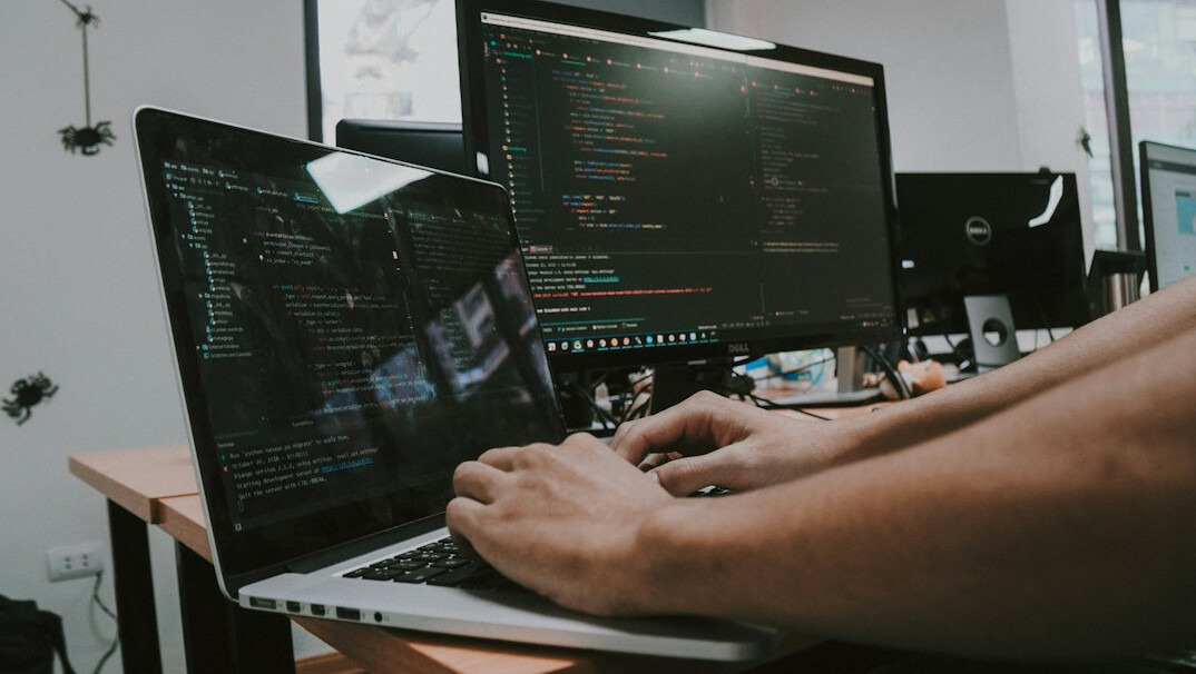 person studying code on laptop