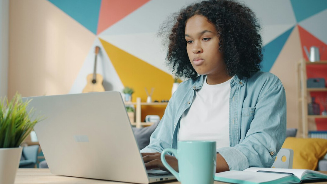 person studying at home desk